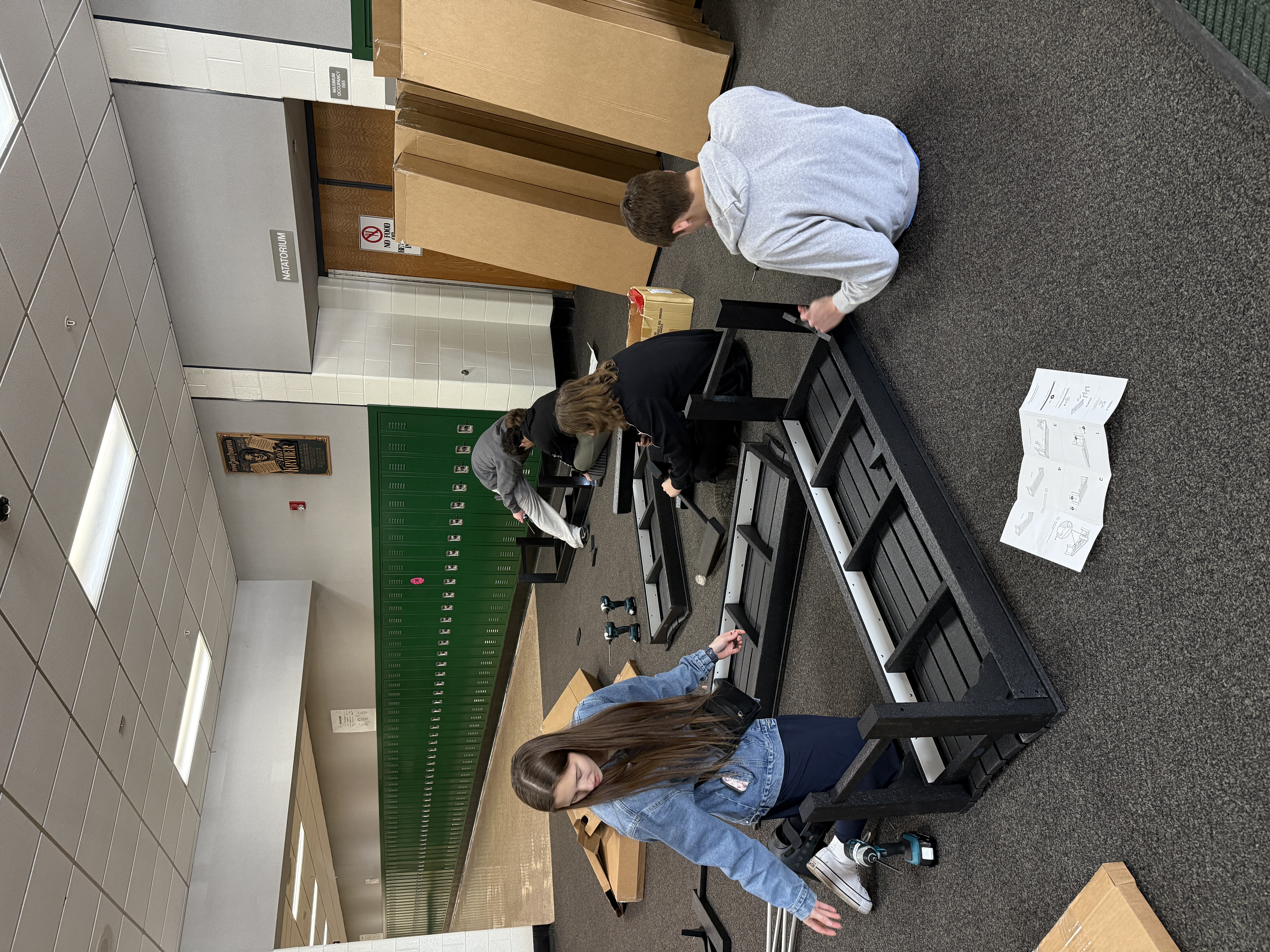 Students work through the bench assembly process