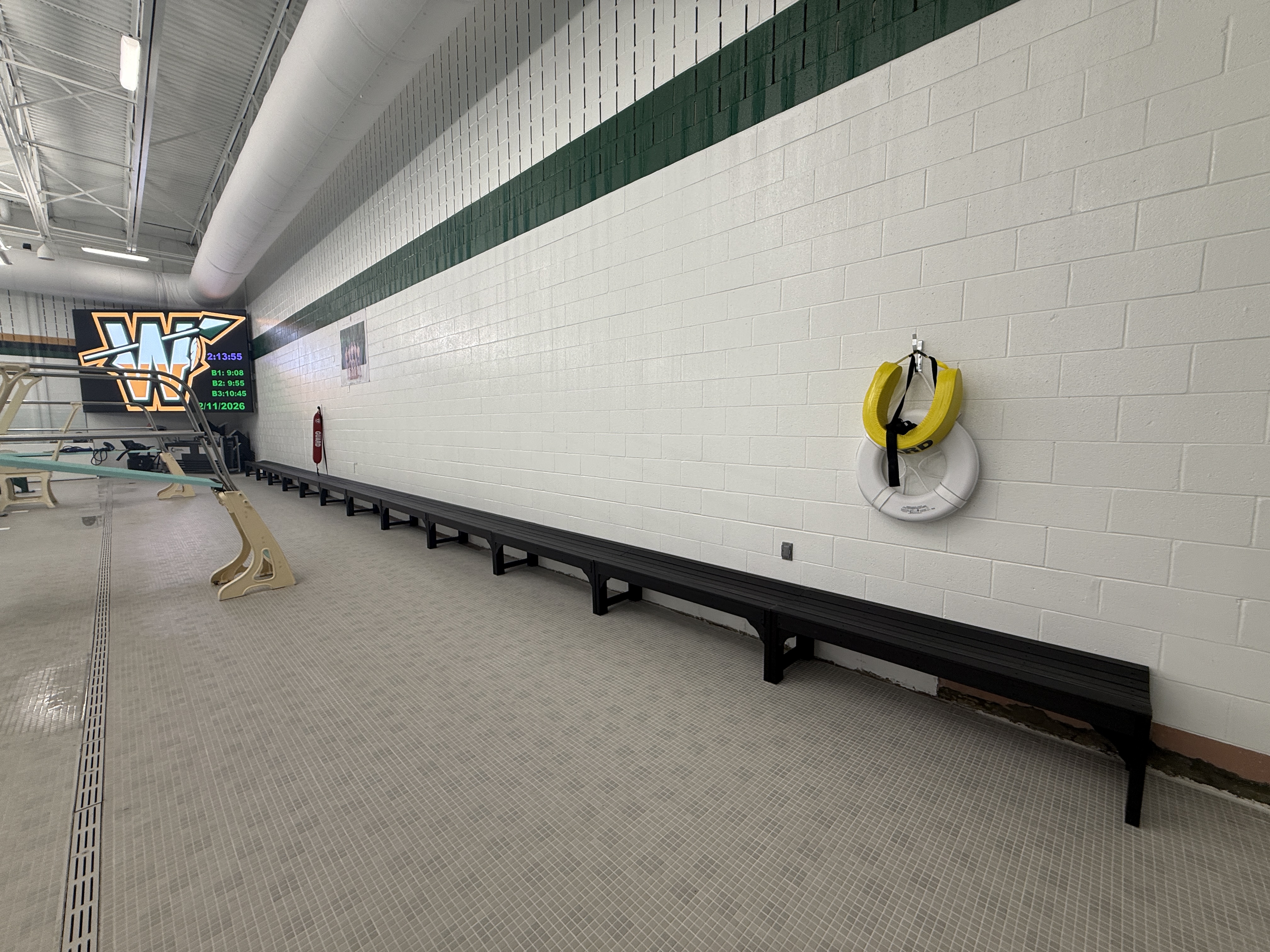 POLYWOOD benches installed along the wall of the newly renovated Wawasee Middle School pool